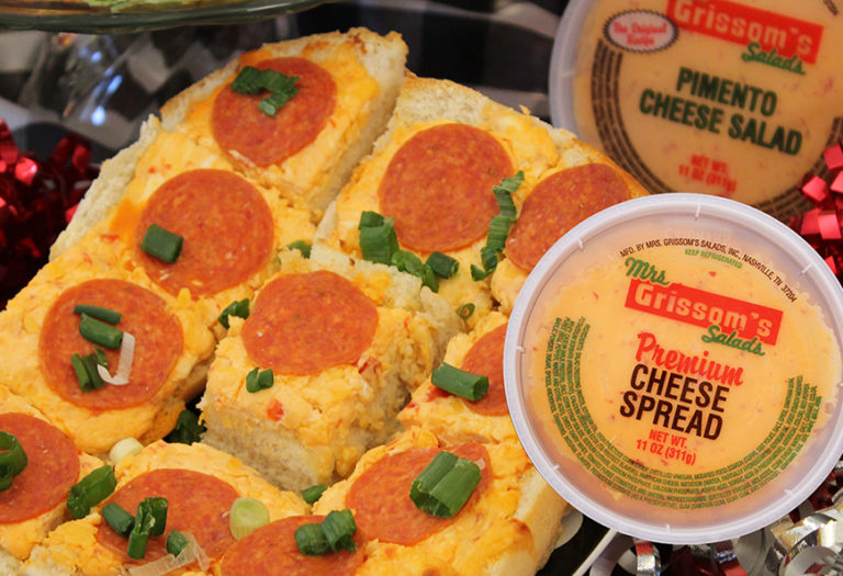 Grissom's premium cheese spread and pimento cheese salad displayed with pepperoni-topped bread slices, showcasing wholesale foodservice products for food distributors and suppliers.